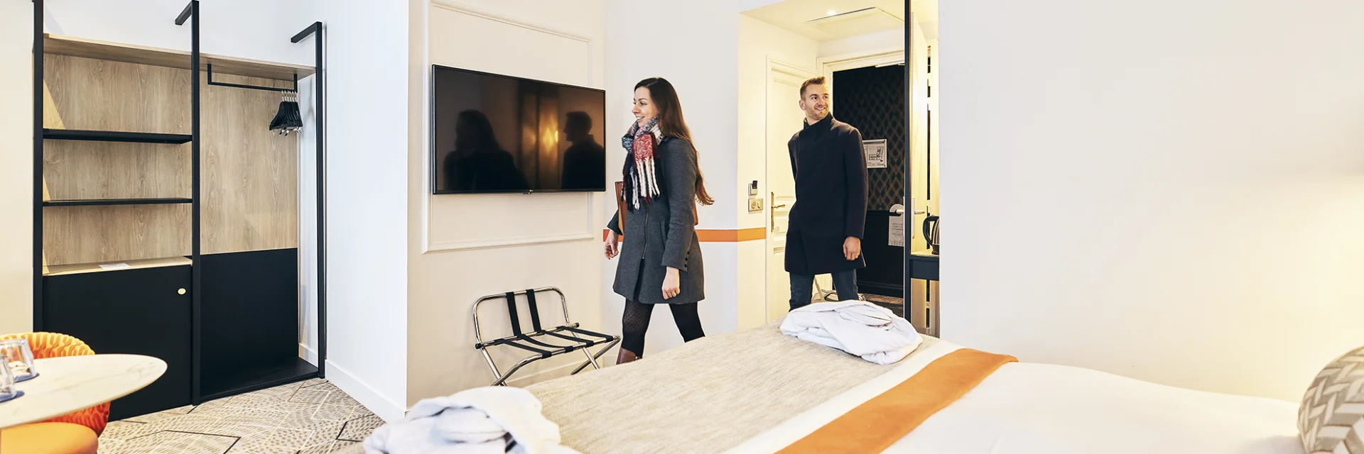 Couple entering their hotel room