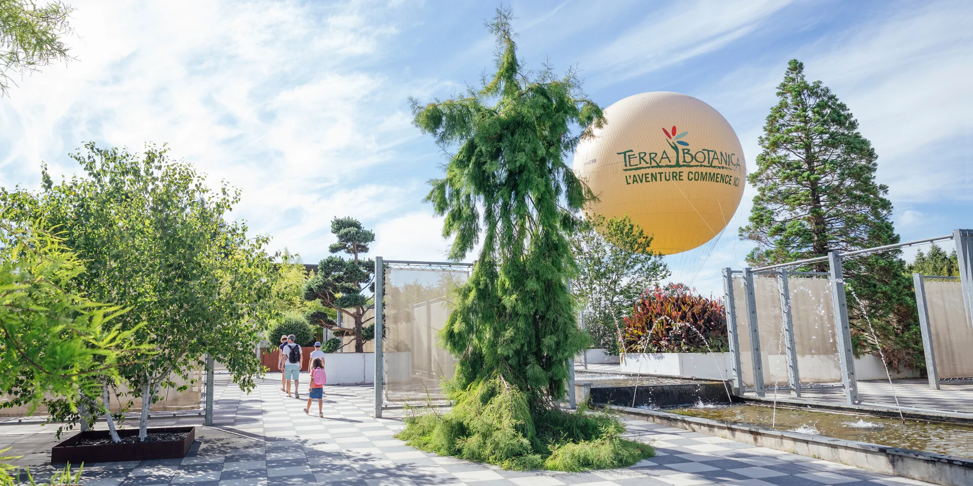 Trimmed fir tree and Terra Botanica balloon in the background