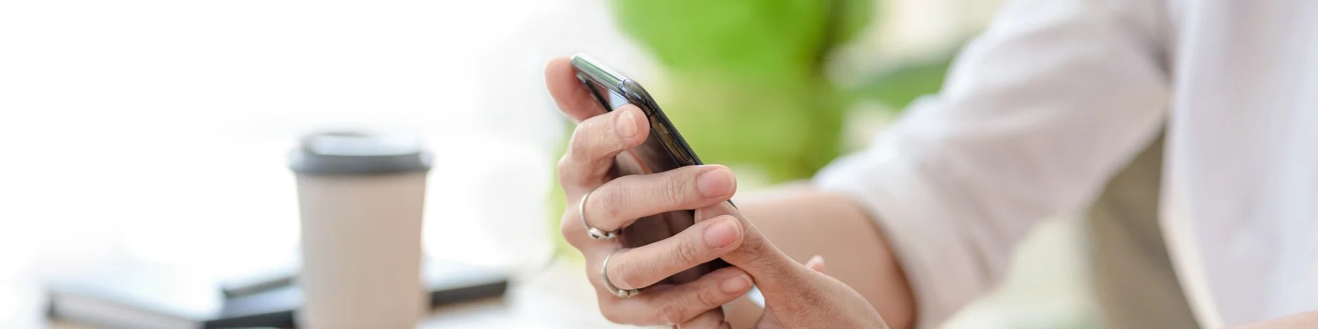 Close up. Woman hand using smartphone order goods online.